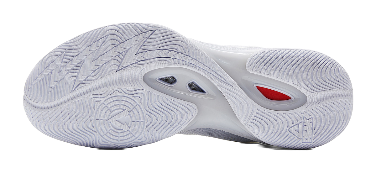 White and silver basketball shoe outsole with traction tread and heel cushioning detail