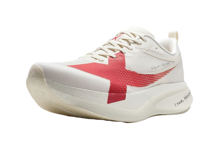 Low-top running shoe, white and red knit upper with lace-up closure and thick sole.