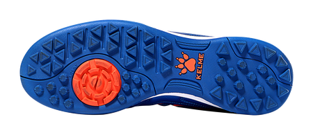 Kelme royal blue outsole with red traction insert and stud tread for turf