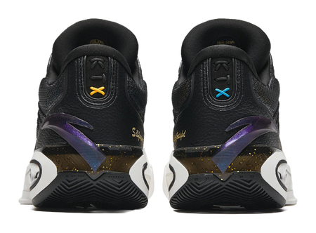 Heel and side view of black and white basketball shoes with colorful logo accents