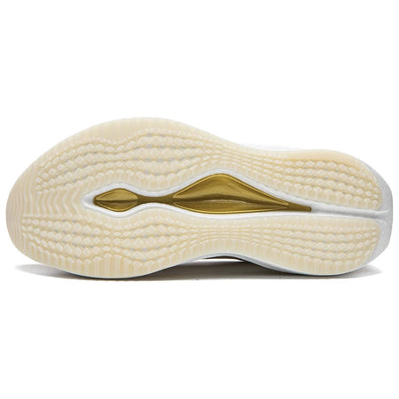 Undersole of khaki running shoe with gold side stripe and textured tread