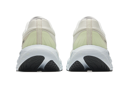 Men's low-top running shoe heels, cream uppers with light-blue midsole and black tread pods