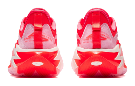 Pink and red basketball shoes heel view with molded outsole and branding on back