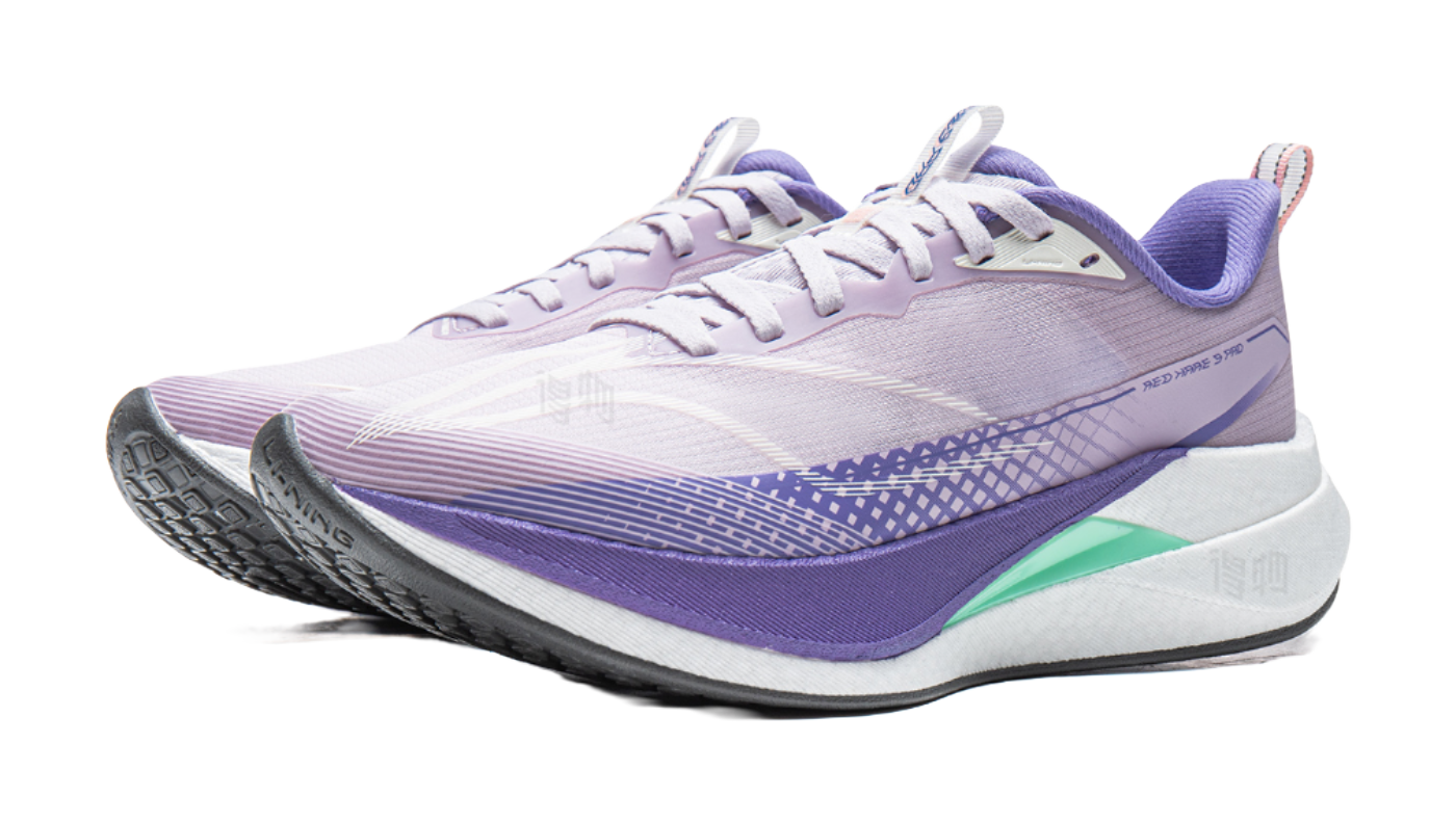 Lavender purple running shoe with white laces, purple trim, and green heel accent