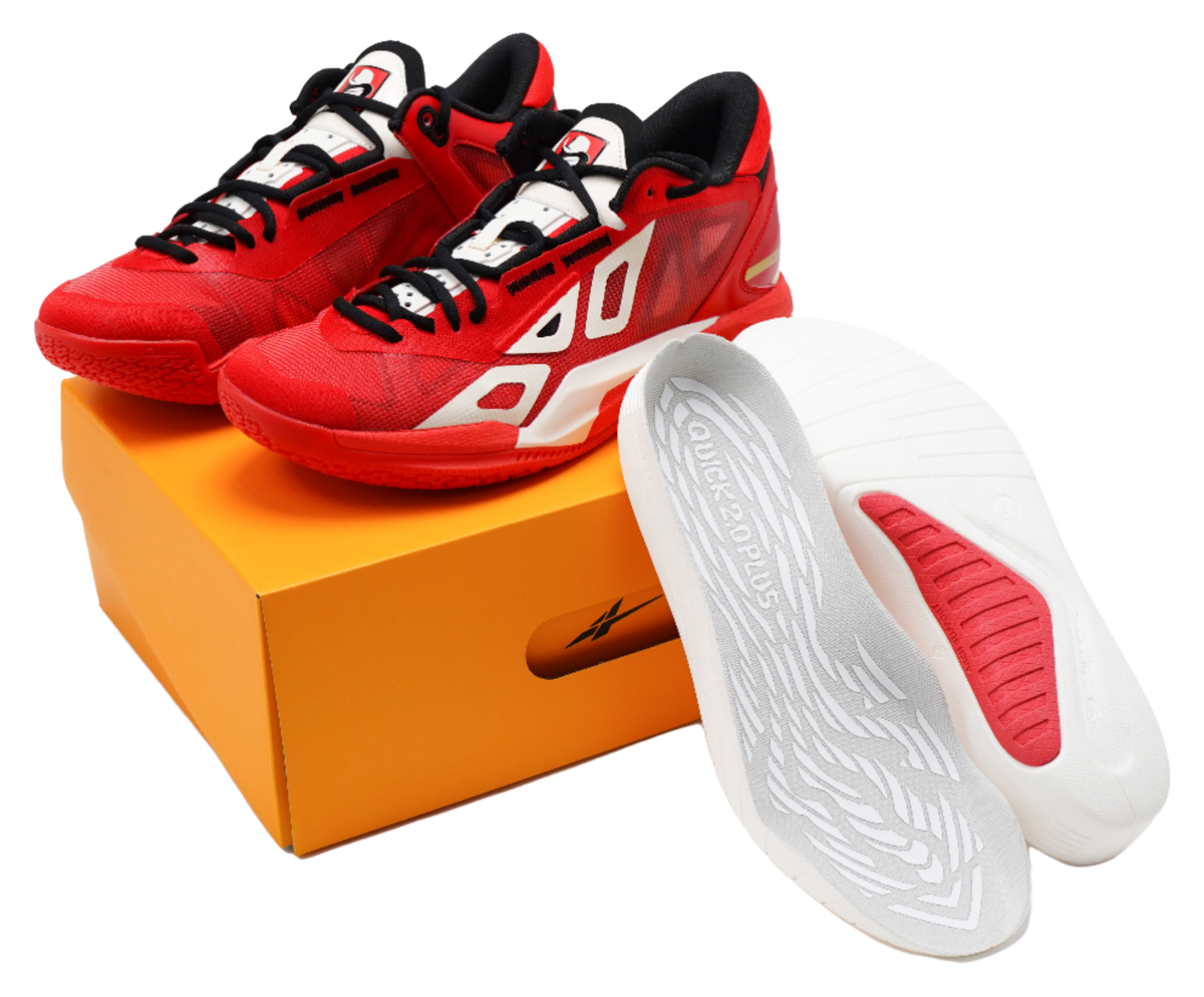 Red low-top basketball shoes with black laces, white logo, and gray insole