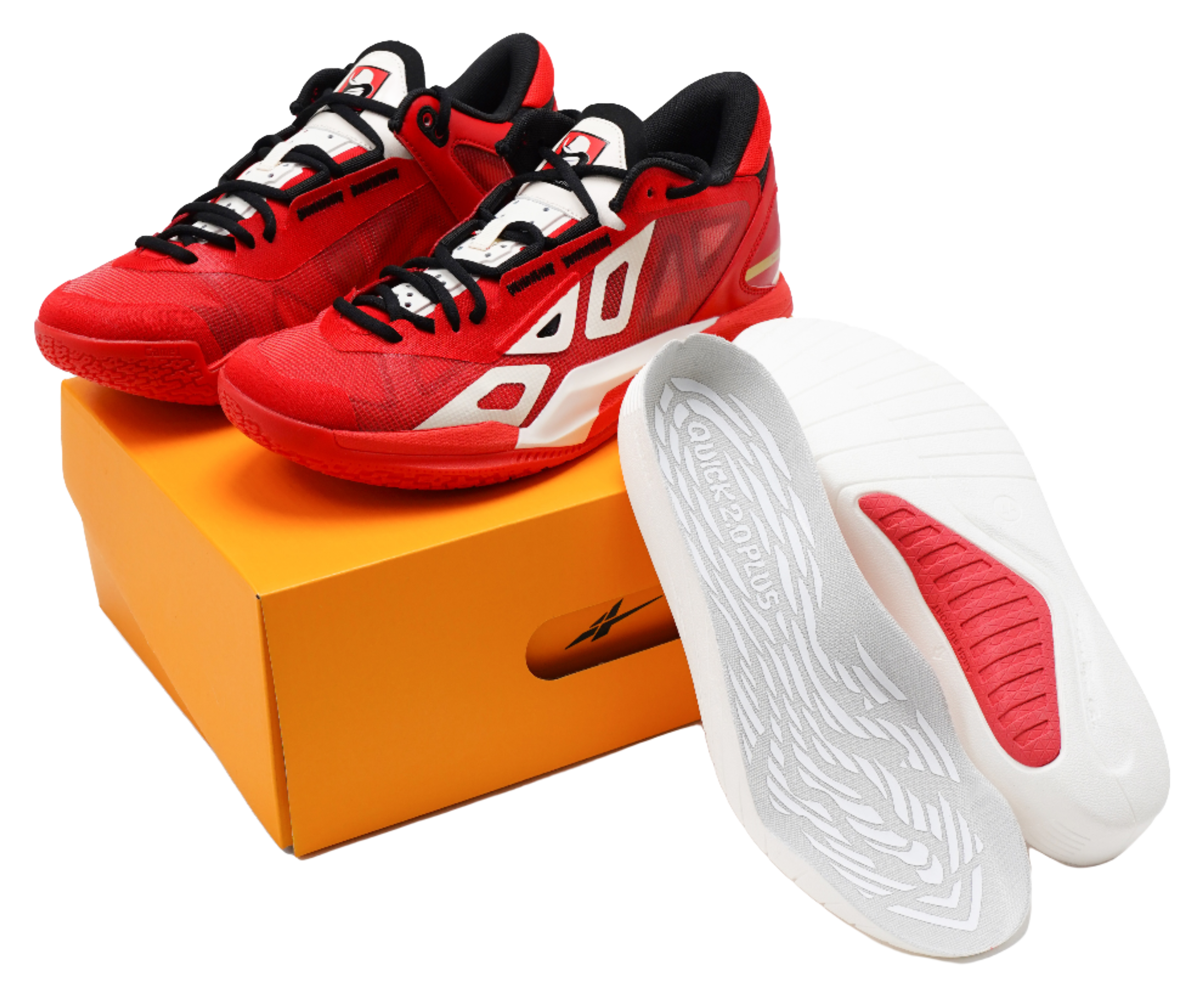 Red low-top basketball shoes with black laces, white logo, and gray insole