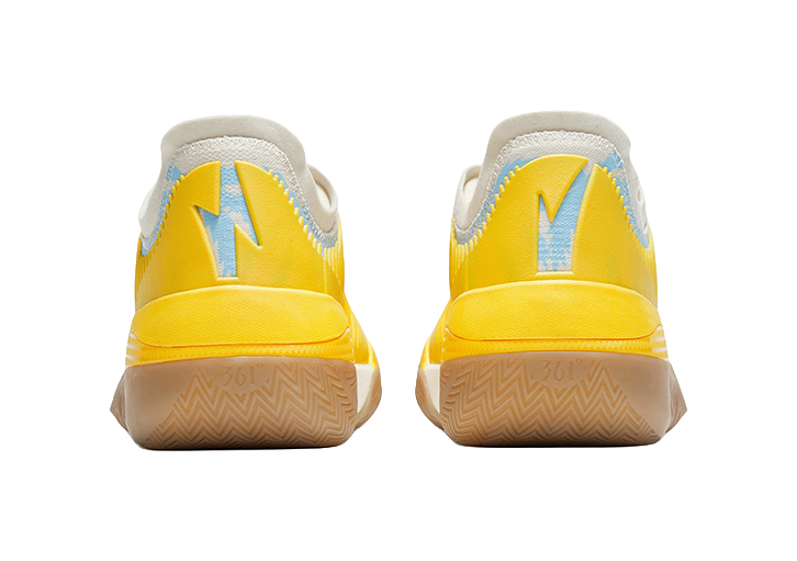 Vintage yellow low basketball shoes rear view with heel tabs and patterned sole
