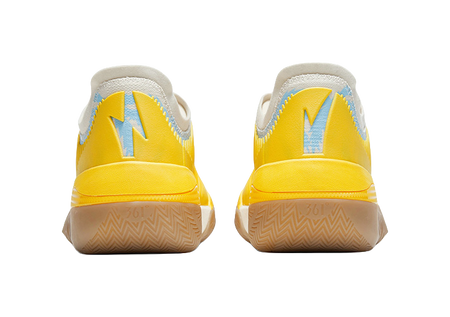 Vintage yellow low basketball shoes rear view with heel tabs and patterned sole