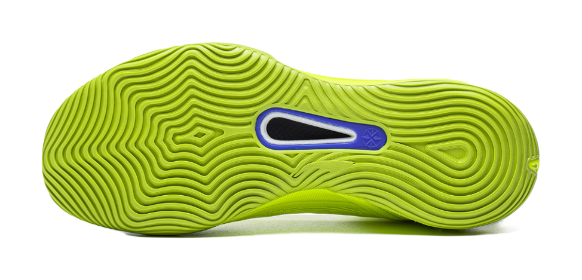 Green basketball shoe outsole with wavy traction grooves and blue insert