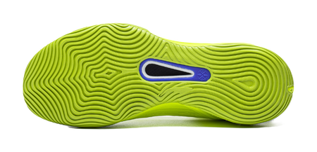 Green basketball shoe outsole with wavy traction grooves and blue insert