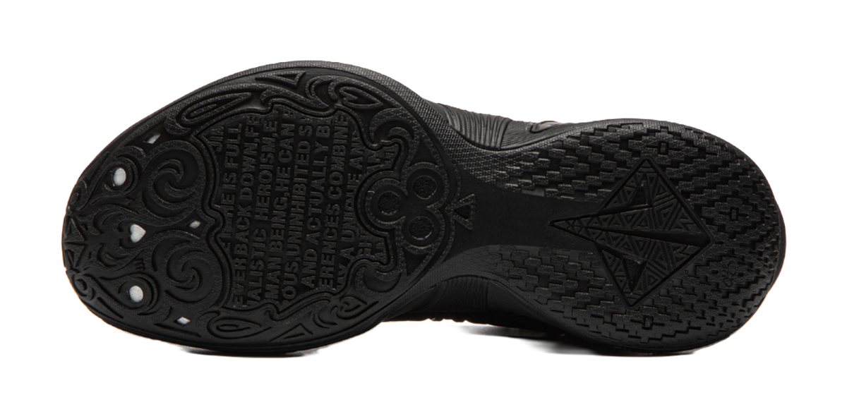 Black basketball shoe outsole with traction tread pattern and star-shaped grooves
