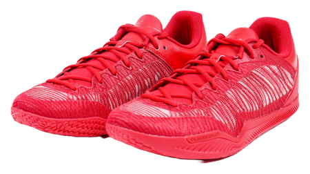 Pair of red basketball shoes with lace-up fronts and textured knit uppers