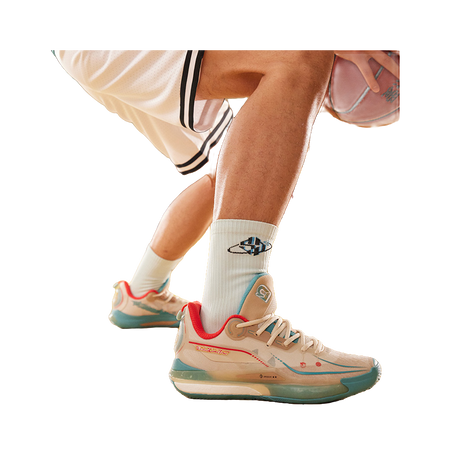 Unisex basketball shoe worn with white socks; oat beige and teal colorway visible