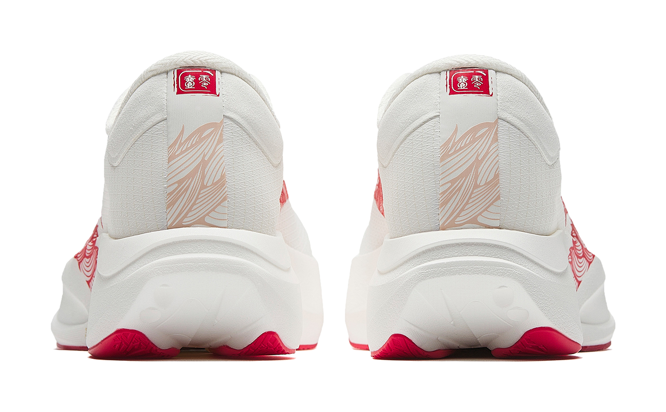 White running shoe heels with red trim and rear logo badge