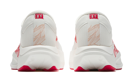 White running shoe heels with red trim and rear logo badge