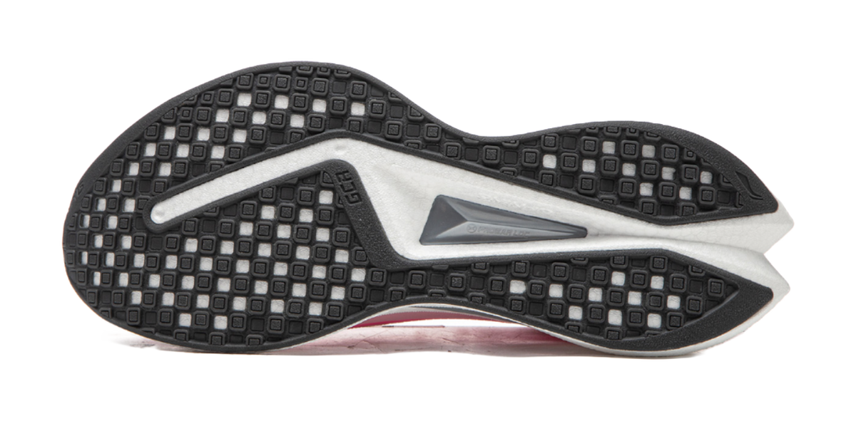 Outsole for pink running shoe with black tread pattern and gray center panel