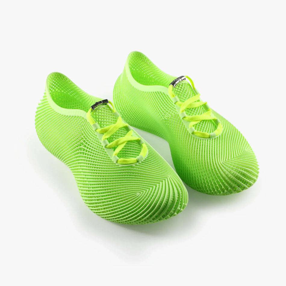 Neon green 3D-printed sneakers with lace-up straps and textured grid sole
