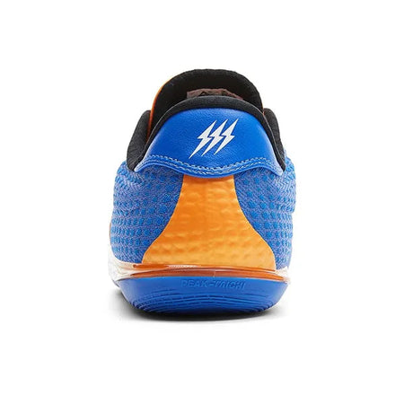 Back view basketball shoe in blue with orange heel panel, black collar, logo