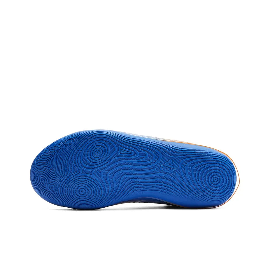Blue basketball shoe outsole with patterned tread and a yellow edge