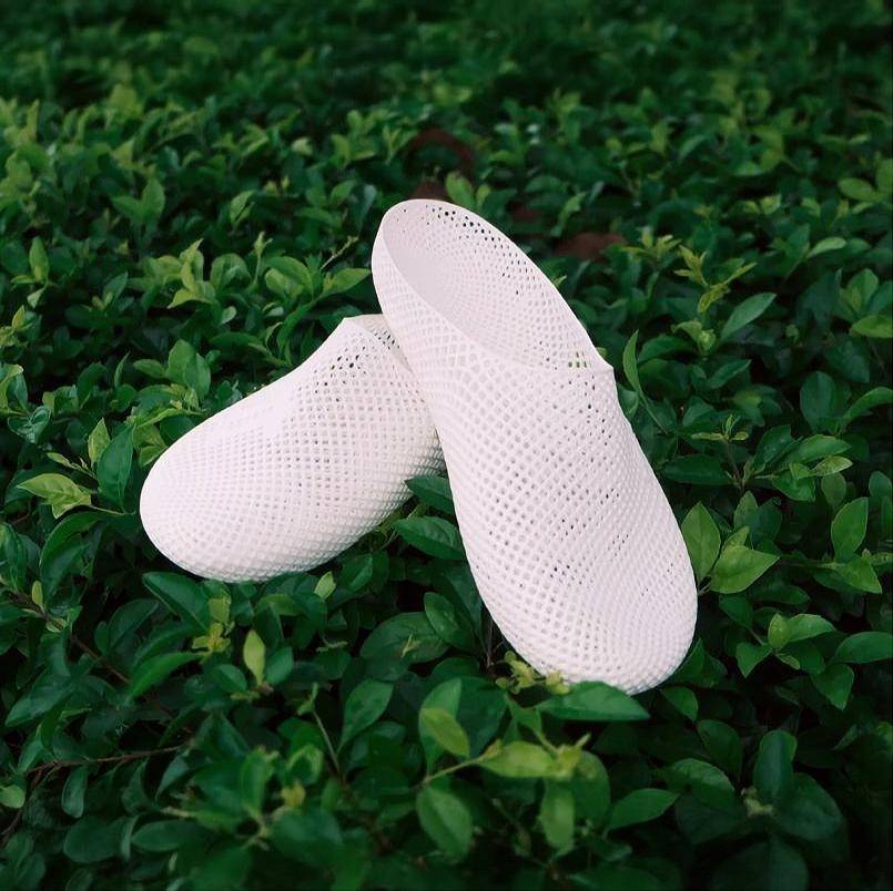 White 3D printed slip-on slippers with textured grid pattern