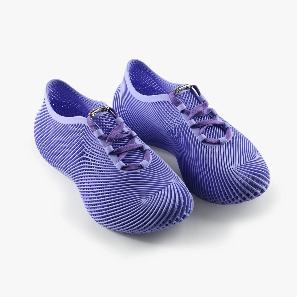 Purple 3D-printed sneakers with lace-up straps and textured ribbed tread