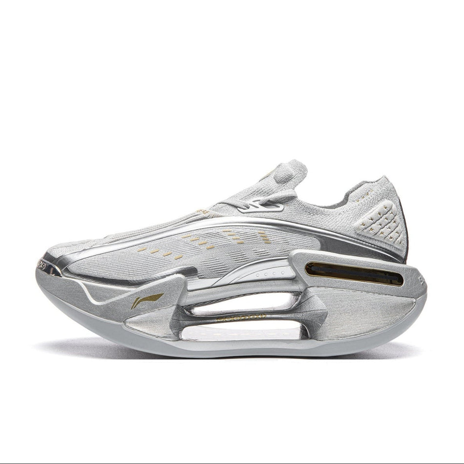 A metallic silver low-top sneaker shown in profile against a white background, with black bars and a phone interface overlay around the image.