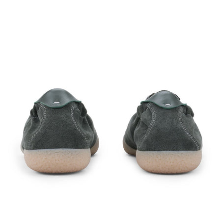 A pair of dark gray suede low-top sneakers shown from the back, featuring light tan rubber soles, displayed on a white background.