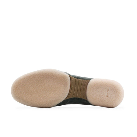 A close-up of a shoe sole, showing a beige toe cap and heel section with a dark green midsole, displayed on a white background within a mobile app screenshot.