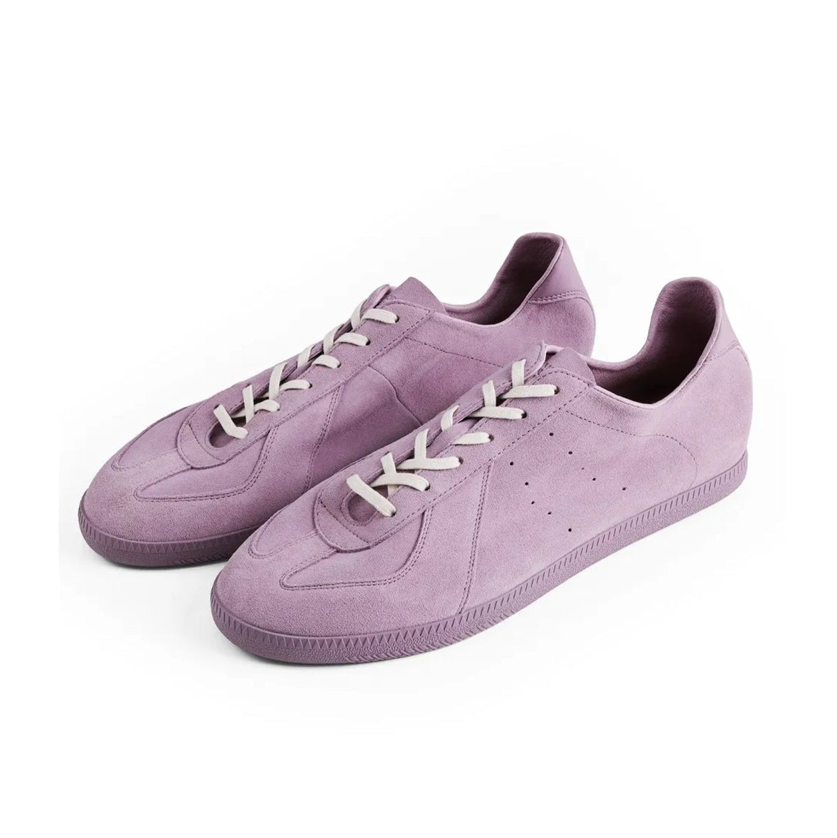 A pair of low-top casual sneakers in a dusty lavender-purple suede-like material with white laces, shown on a plain white background.
