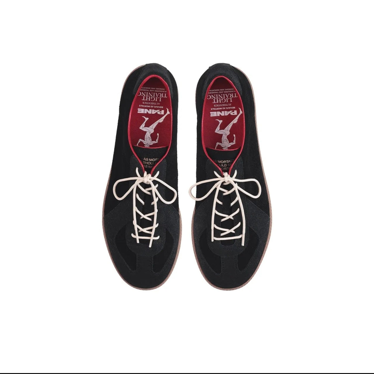 A pair of black low-top racing shoes shown from a top-down view on a white background, with white laces and red interior lining featuring a white stylized 'Z' logo. The image is captured from a mobile app screenshot with black bars and product info text below.