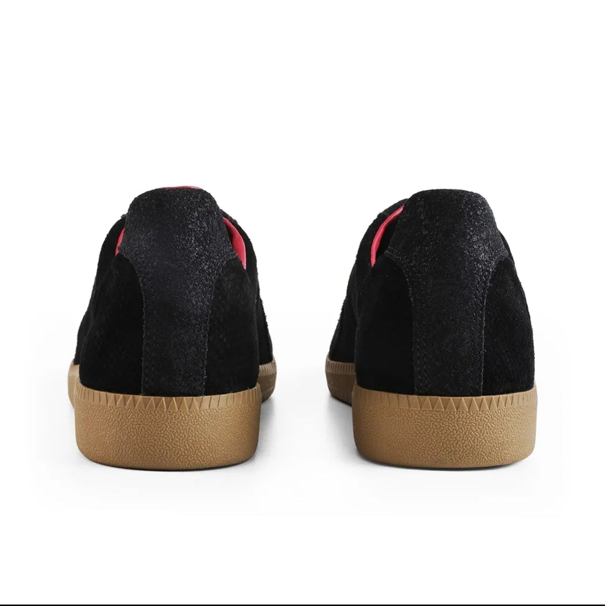 Black racerback low-top sneakers shown from the back, featuring a black textured suede upper, a thin red stripe detail near the collar, and a tan rubber sole.