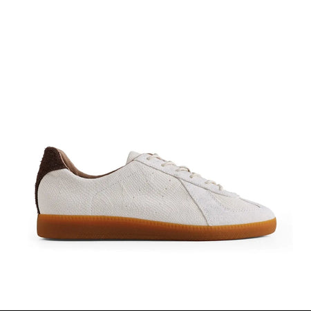 A white leather sneaker with a brown heel tab and a gum brown sole, shown in a side profile on a white background. The image is captured from a mobile app screenshot with black bars at the top and bottom and text identifying the shoe as 'PYTHON ALBINO 5247'.