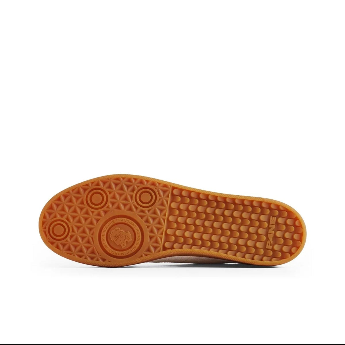 A close-up of a shoe's outsole showing a textured brown rubber tread pattern, displayed on a white background with black letterboxing and Chinese text below.