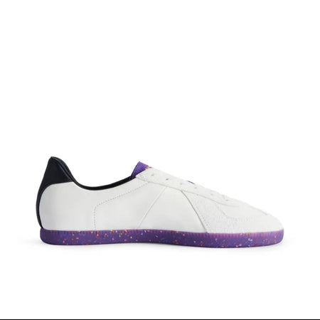 A white low-top sneaker with a purple textured sole and a black heel tab, shown on a white background within a mobile app interface.