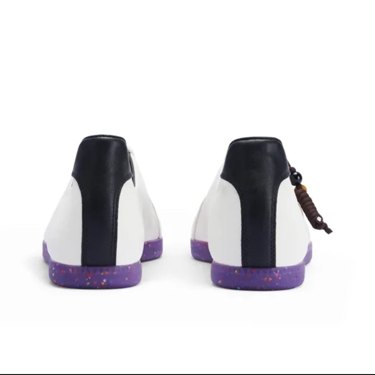 A pair of high-top sneakers shown from the back, featuring a white and black upper with purple soles, displayed on a white background.