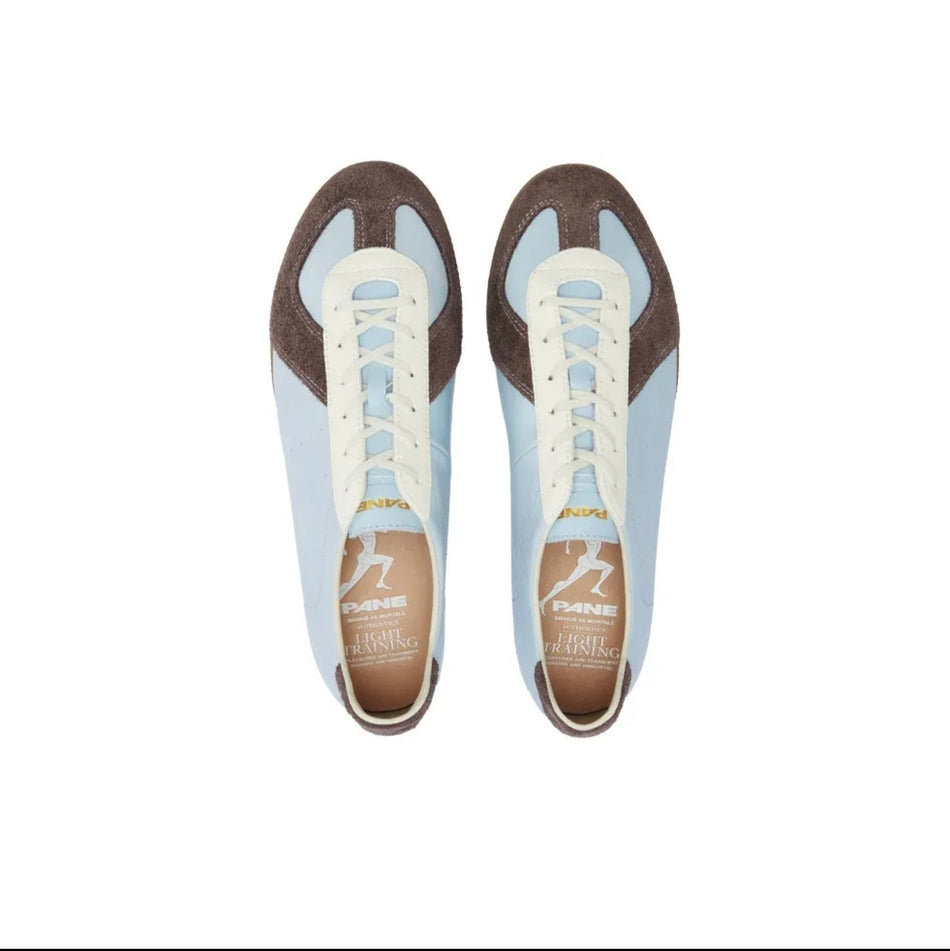 A pair of low-top sneakers shown from a top-down view on a white background, with black phone app interface bars around the image. The shoes are light blue with brown panels and white laces.