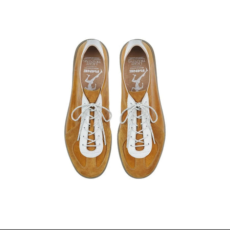 A pair of low-top lace-up shoes shown from above on a white background, with a black phone app interface around the photo. The shoes appear tan or camel brown with white laces and white trim around the collar and eyelets.