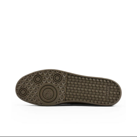 A close-up of a shoe sole, showing the tread pattern and rubber texture in a dark brown color, displayed on a white background with black header and footer bars.