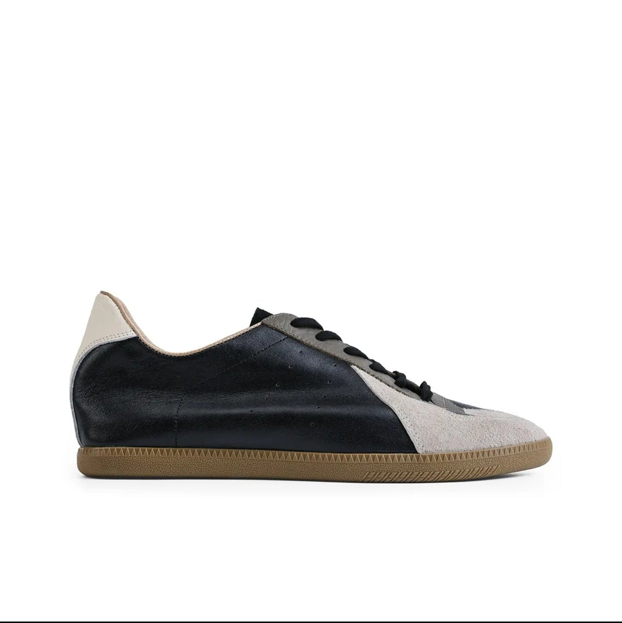 A low-top sneaker shown on a white background within a mobile app interface. The shoe has a dark navy leather upper with a light beige suede toe cap and heel, black laces, and a tan gum sole.