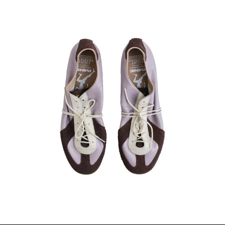 A pair of low-top lace-up shoes shown from a top-down view on a white background, with black letterboxing and mobile app interface elements around the photo.