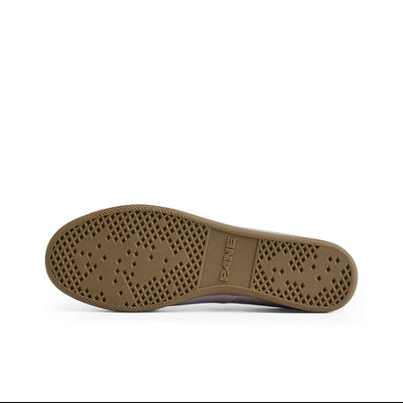 A close-up of a shoe's brown textured rubber outsole, shown against a white background within a mobile app interface.
