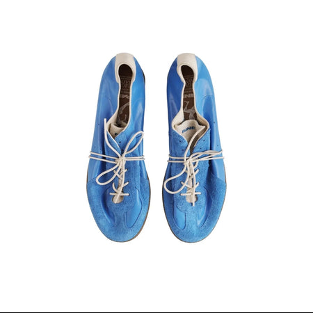 A pair of blue suede Airliner 5214 lace-up shoes shown from a top-down view on a white background, with black phone interface bars around the image.