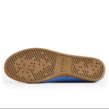 A close-up of a shoe's brown rubber outsole with a pattern of circular holes and the brand name 'XIAER' embossed on the center, shown against a white background.