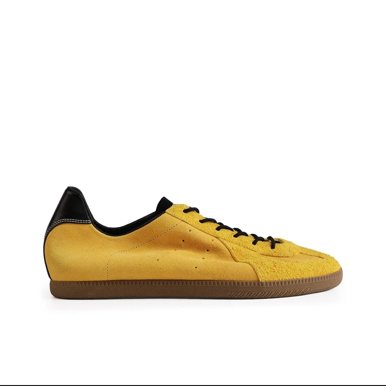 A yellow suede sneaker with black laces, a black heel tab, and a brown gum sole, shown on a white background within a mobile app interface.