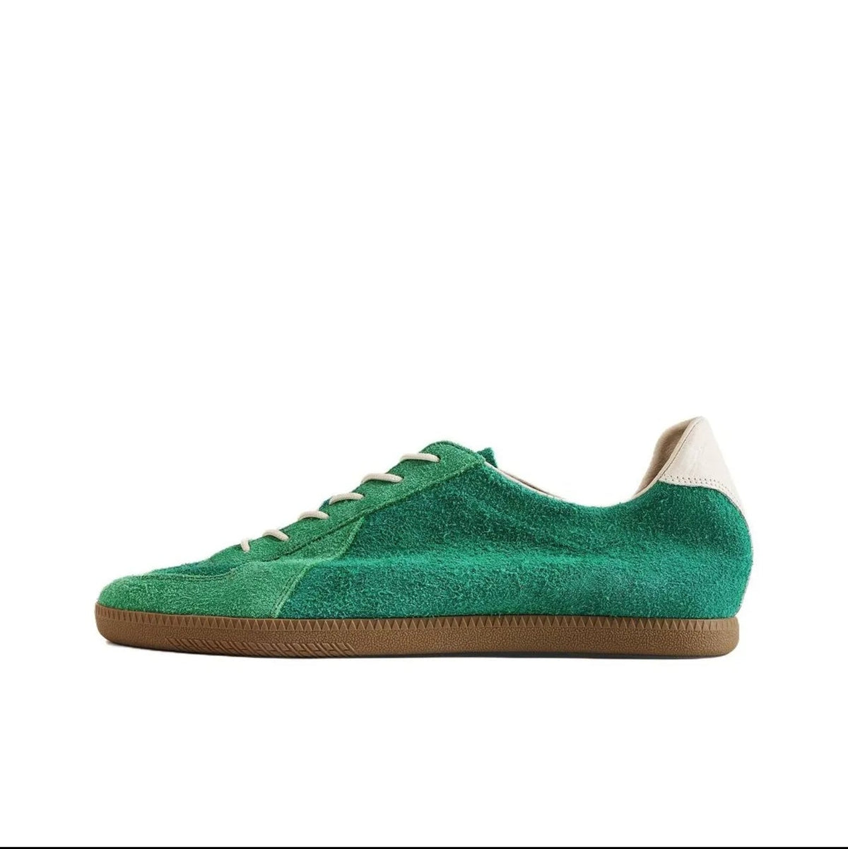 A green suede low-top sneaker with a gum sole, shown on a white background within a mobile app interface. The text below the shoe reads 'WILLOW CREEK 5217'.