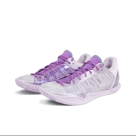 A pair of athletic sneakers in white and light purple, shown from a side angle on a plain white background.