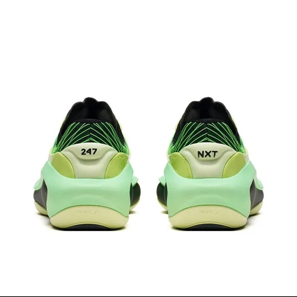 A pair of 247 sneakers shown from the back, featuring a light green and black upper with a yellow-green midsole and the '247' and 'NXT' logos visible.