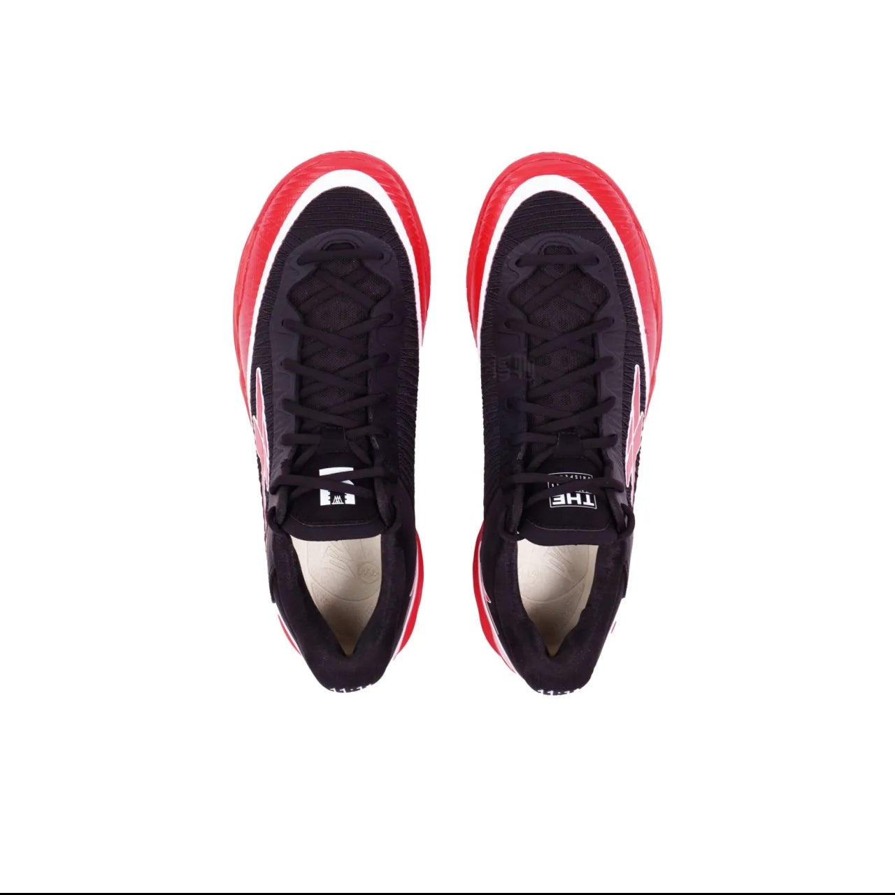 A pair of black low-top athletic sneakers shown from a top-down view on a white background, with red and white side accents.