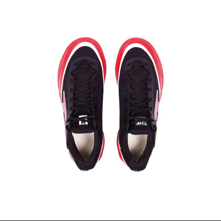 A pair of black low-top athletic sneakers shown from a top-down view on a white background, with red and white side accents.