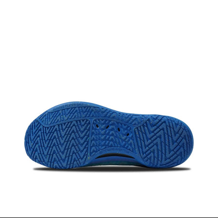 A close-up of a blue textured shoe sole, shown against a white background with black bars at the top and bottom of the screenshot.
